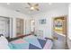 Main bedroom with queen bed, closet, and private access to patio at 100 Palermo St, Davenport, FL 33897