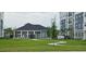 Apartment community featuring a clubhouse and green space at 1210 Southstation Pl # 303, Orlando, FL 32809