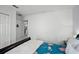 Bedroom with sleigh bed and view into adjacent kitchen area at 167 Castaway Beach Way, Kissimmee, FL 34746