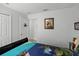 Bedroom featuring a sleigh bed and a decorative wall hanging at 167 Castaway Beach Way, Kissimmee, FL 34746