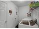 Laundry room with washer, dryer, and shelving at 167 Castaway Beach Way, Kissimmee, FL 34746