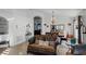 Open-concept living and dining area with tiled floors and decorative accents at 167 Castaway Beach Way, Kissimmee, FL 34746