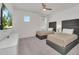 Bedroom with two twin beds, large TV and ceiling fan at 2525 Shanti Dr, Kissimmee, FL 34746