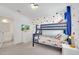 Bedroom with bunk beds, polka dot walls, and en-suite bathroom at 2525 Shanti Dr, Kissimmee, FL 34746