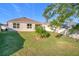 Landscaped backyard with grassy area at 3290 Logan Berry Dr, Mount Dora, FL 32757