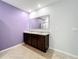 Double sink bathroom with a large mirror at 3290 Logan Berry Dr, Mount Dora, FL 32757