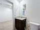 Small bathroom with granite countertop and toilet at 3290 Logan Berry Dr, Mount Dora, FL 32757