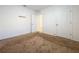 Simple bedroom with neutral carpeting and two closets at 3290 Logan Berry Dr, Mount Dora, FL 32757