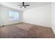 Bright bedroom with ceiling fan and neutral carpet at 3290 Logan Berry Dr, Mount Dora, FL 32757