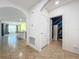 Tile entryway with view into living area and laundry room at 3290 Logan Berry Dr, Mount Dora, FL 32757