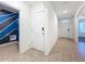 Bright entryway with tile flooring and interior laundry access at 3290 Logan Berry Dr, Mount Dora, FL 32757