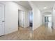Clean hallway with tile floors and archways at 3290 Logan Berry Dr, Mount Dora, FL 32757