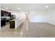Modern kitchen with dark cabinetry, granite countertops, and an island at 3290 Logan Berry Dr, Mount Dora, FL 32757