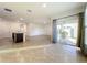 Open concept kitchen with island and view into the living room at 3290 Logan Berry Dr, Mount Dora, FL 32757