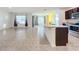 Open kitchen with island, granite countertops, and stainless steel appliances at 3290 Logan Berry Dr, Mount Dora, FL 32757