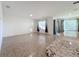 Bright living room with tile floors and sliding glass doors leading to the backyard at 3290 Logan Berry Dr, Mount Dora, FL 32757