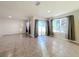 Spacious living area featuring tile floors and multiple windows at 3290 Logan Berry Dr, Mount Dora, FL 32757