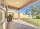 Covered patio with grill and backyard view at 3290 Logan Berry Dr, Mount Dora, FL 32757