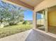 Covered patio with sliding glass doors and water view at 3290 Logan Berry Dr, Mount Dora, FL 32757