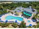 Resort-style pool with multiple lounge chairs and a hot tub at 411 Lucaya Loop # 411, Davenport, FL 33897