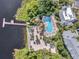 Resort pool with beach access and a wooden dock at 411 Lucaya Loop # 411, Davenport, FL 33897
