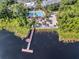 Resort pool, beach access, and a wooden dock on the lake at 411 Lucaya Loop # 411, Davenport, FL 33897
