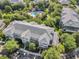 Aerial view of building with pool and parking at 411 Lucaya Loop # 411, Davenport, FL 33897