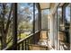 Private screened balcony overlooking lush greenery at 411 Lucaya Loop # 411, Davenport, FL 33897