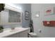 Bathroom with updated vanity, toilet, and walk-in shower at 411 Lucaya Loop # 411, Davenport, FL 33897