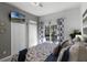 Bright bedroom with a king-size bed, TV, and access to a private balcony at 411 Lucaya Loop # 411, Davenport, FL 33897
