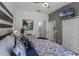 King-size bed, large artwork, and access to a bathroom and closet at 411 Lucaya Loop # 411, Davenport, FL 33897