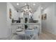 Open concept kitchen with breakfast bar and white cabinets at 411 Lucaya Loop # 411, Davenport, FL 33897