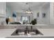 Clean kitchen sink with a view into living room at 411 Lucaya Loop # 411, Davenport, FL 33897