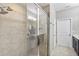 Bathroom with shower stall, double vanity, and tiled floor at 4700 Nathan Hale Blvd, St Cloud, FL 34769