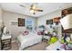 Bedroom with double bed, desk, and ceiling fan at 4700 Nathan Hale Blvd, Saint Cloud, FL 34769