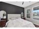 Spacious bedroom with a king-size bed and dark accent wall at 4700 Nathan Hale Blvd, Saint Cloud, FL 34769