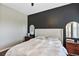Bright bedroom with king-size bed and dark accent wall at 4700 Nathan Hale Blvd, St Cloud, FL 34769