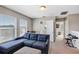 Upstairs bonus room with sectional sofa and access to bathroom at 4700 Nathan Hale Blvd, St Cloud, FL 34769
