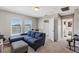 Upstairs bonus room with sectional sofa and built-in shelving at 4700 Nathan Hale Blvd, St Cloud, FL 34769