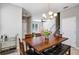 Dining room with table and seating, view into living room and stairs at 4700 Nathan Hale Blvd, St Cloud, FL 34769