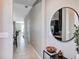 Bright entryway with a circular mirror and console table at 4700 Nathan Hale Blvd, St Cloud, FL 34769
