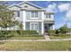 Two-story house with gray siding, landscaping, and a welcoming front porch at 4700 Nathan Hale Blvd, St Cloud, FL 34769