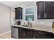 Kitchen with sink, granite countertop and dark brown cabinets at 4700 Nathan Hale Blvd, St Cloud, FL 34769