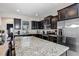 Modern kitchen with stainless steel appliances and granite countertops at 4700 Nathan Hale Blvd, St Cloud, FL 34769