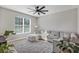 Living room featuring a sectional sofa and large windows at 4700 Nathan Hale Blvd, St Cloud, FL 34769