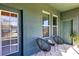 Small patio with two chairs and a side table at 4700 Nathan Hale Blvd, St Cloud, FL 34769
