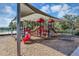 Shaded playground with multiple play features at 4700 Nathan Hale Blvd, St Cloud, FL 34769