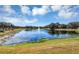 Pond with water fountain and reflection of clouds at 4700 Nathan Hale Blvd, St Cloud, FL 34769