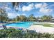 Community pool with lounge chairs and shaded areas at 4700 Nathan Hale Blvd, St Cloud, FL 34769