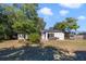 Large backyard with grassy area and patio at 59 Pine Dr, Debary, FL 32713
